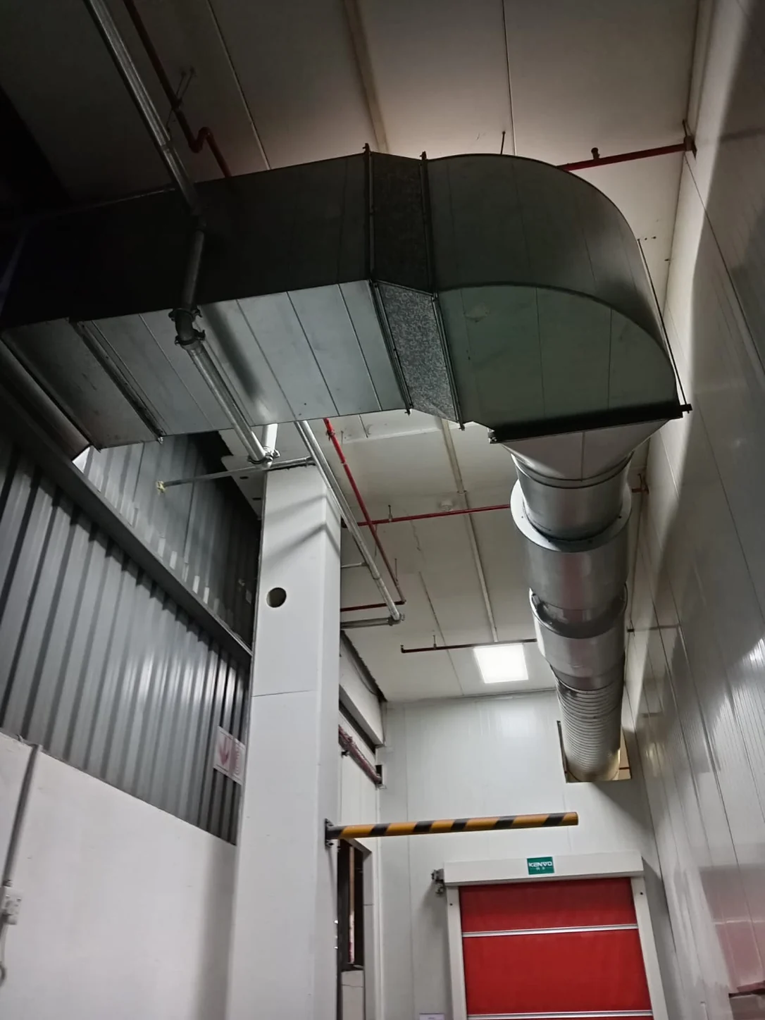 Technicians carrying out external duct installation work at a Gauteng site